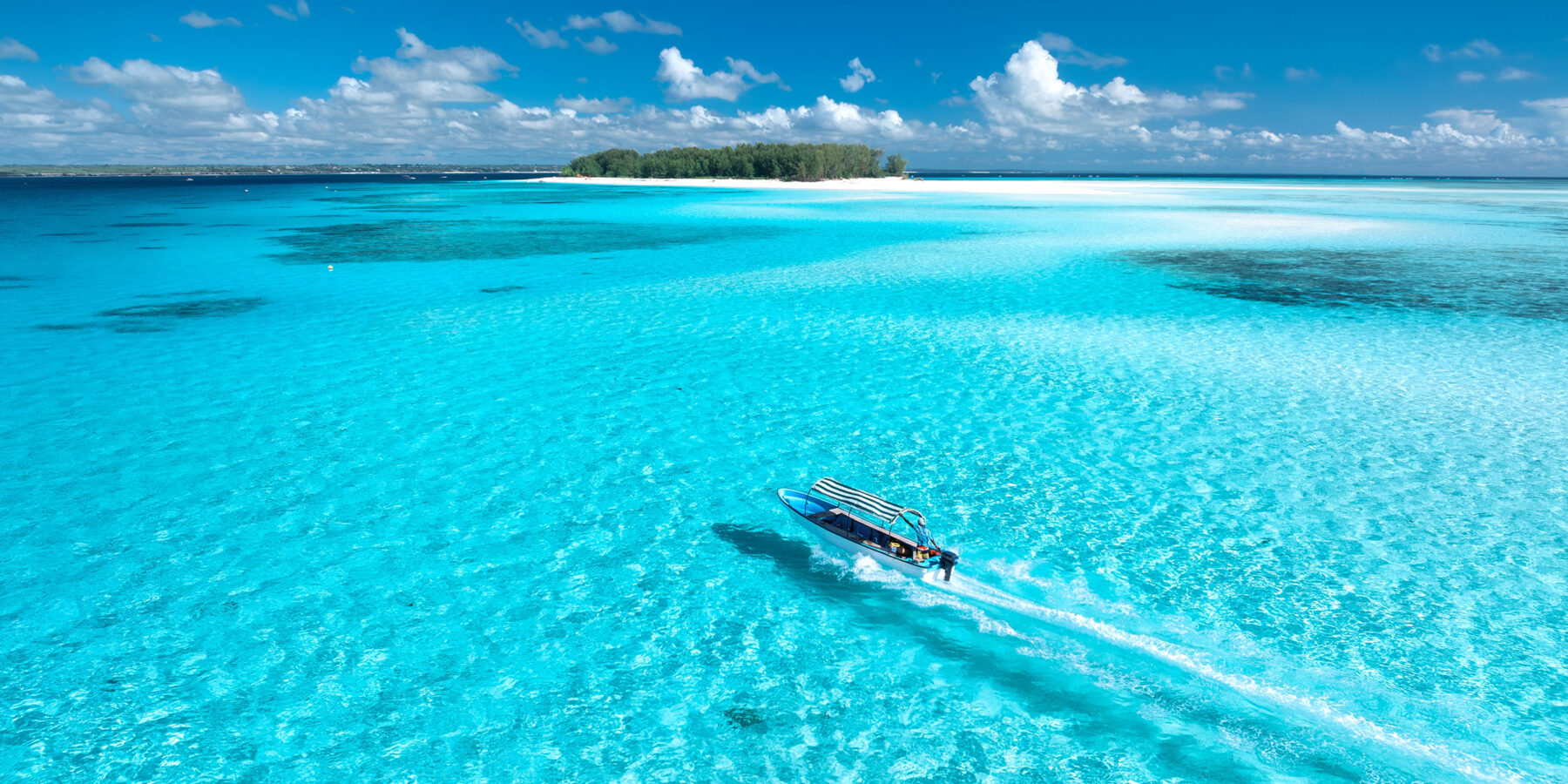 Aerial,View,Of,Floating,Boat,In,Transparent,Azure,Water,On